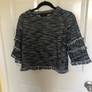 Black and white cropped sweater with fringe